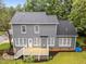 A back view of this 2-story home features a deck and fenced yard at 2913 Coxindale Dr, Raleigh, NC 27615