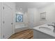 Bright bathroom featuring a jetted tub, and double doors at 2913 Coxindale Dr, Raleigh, NC 27615
