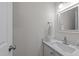 This half-bath features a single sink vanity with a mirror and a towel rack at 2913 Coxindale Dr, Raleigh, NC 27615