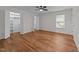 Spacious bedroom features wood-look floors, a ceiling fan, and a walk-in closet with custom shelving at 2913 Coxindale Dr, Raleigh, NC 27615