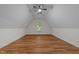 This spacious bedroom features a vaulted ceiling, a ceiling fan, and wood-look flooring at 2913 Coxindale Dr, Raleigh, NC 27615