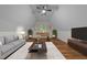 Relaxed bonus room in the finished attic for fun with a sofa and foosball table at 2913 Coxindale Dr, Raleigh, NC 27615