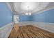 Dining room featuring elegant wainscoting, chandelier, and access to kitchen at 2913 Coxindale Dr, Raleigh, NC 27615