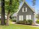 Charming home exterior with manicured lawn, brick accents, and gray siding at 2913 Coxindale Dr, Raleigh, NC 27615