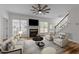 Bright living room with fireplace, staircase, and natural light creating a welcoming space at 2913 Coxindale Dr, Raleigh, NC 27615
