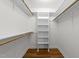 This walk-in closet has built-in shelves and rods for ample storage at 2913 Coxindale Dr, Raleigh, NC 27615