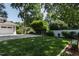 Well manicured lawn and landscaping provide a serene backdrop to the garage on this property at 308 W Whitaker Mill Rd, Raleigh, NC 27608