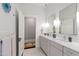 Elegant bathroom with double vanity, marble countertop, and modern fixtures at 308 W Whitaker Mill Rd, Raleigh, NC 27608