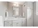 Well-lit bathroom features a marble-top vanity, shaker cabinets, ample storage, and modern fixtures at 308 W Whitaker Mill Rd, Raleigh, NC 27608