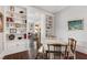 Elegant dining room with built-in shelves, hardwood floors, and seamless flow to living areas at 308 W Whitaker Mill Rd, Raleigh, NC 27608