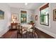 Charming dining room featuring hardwood floors, natural light, and elegant furnishings at 308 W Whitaker Mill Rd, Raleigh, NC 27608