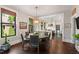 Bright dining area with modern lighting fixture and open layout leading into a modern kitchen at 308 W Whitaker Mill Rd, Raleigh, NC 27608