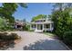 Beautiful single-story home with a long driveway and landscaped front yard at 308 W Whitaker Mill Rd, Raleigh, NC 27608