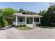 Charming single-story home with green shutters, a large front porch, and manicured landscaping at 308 W Whitaker Mill Rd, Raleigh, NC 27608
