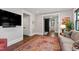 Comfortable living room view with open doorway, TV and ornamental carpet at 308 W Whitaker Mill Rd, Raleigh, NC 27608