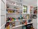 Well-organized pantry with ample shelving for food and kitchen storage at 308 W Whitaker Mill Rd, Raleigh, NC 27608
