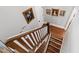 Elegant hardwood staircase with painted risers and stylish lighting at 308 W Whitaker Mill Rd, Raleigh, NC 27608