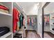 Spacious walk-in closet featuring custom shelving, hanging racks, and a stylish rug, offering ample storage at 308 W Whitaker Mill Rd, Raleigh, NC 27608