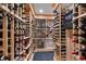 Custom wine cellar with wooden racks showcasing an extensive wine collection and climate control system at 308 W Whitaker Mill Rd, Raleigh, NC 27608