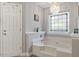Bathtub with tile and stained glass window, including a view of the rest of the room at 3298 Oakridge Dr # A, Graham, NC 27253