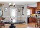Open dining area with hardwood floors conveniently located next to the kitchen at 3298 Oakridge Dr # A, Graham, NC 27253