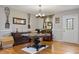 Elegant dining room with hardwood floors, chandelier, and ample space for entertaining at 3298 Oakridge Dr # A, Graham, NC 27253