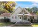 Charming single-story home featuring a covered front porch and well-maintained landscaping at 3298 Oakridge Dr # A, Graham, NC 27253
