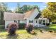 Inviting single-story home with lush front yard landscaping and a cozy covered porch at 3298 Oakridge Dr # A, Graham, NC 27253