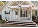 Welcoming front porch with decorative accents and space for outdoor seating at 3298 Oakridge Dr # A, Graham, NC 27253