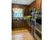 Kitchen features dark wood cabinets, black countertops, and stainless steel appliances, including a Viking oven at 3298 Oakridge Dr # A, Graham, NC 27253