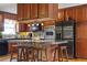 Spacious kitchen featuring custom cabinets, stainless steel appliances, and a central island with seating at 3298 Oakridge Dr # A, Graham, NC 27253