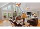 Comfortable living room featuring high ceilings, many windows, and French doors leading to the backyard at 3298 Oakridge Dr # A, Graham, NC 27253