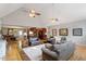An open concept living room with hardwood floors and a view of the kitchen at 3298 Oakridge Dr # A, Graham, NC 27253