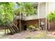 Exterior of home featuring a screened porch, patio area, and backyard surrounded by trees at 352 Weymouth Close, Pittsboro, NC 27312