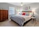 Comfortable bedroom with a decorative headboard, dresser, and bedside tables at 352 Weymouth Close, Pittsboro, NC 27312