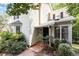 Charming home exterior with manicured landscaping, brick walkway, and neutral siding at 352 Weymouth Close, Pittsboro, NC 27312