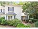Charming home exterior with manicured landscaping, front porch, and neutral siding at 352 Weymouth Close, Pittsboro, NC 27312