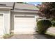 Attached garage with an access number on the front and partial greenery on the side at 352 Weymouth Close, Pittsboro, NC 27312