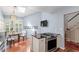Well-lit kitchen with a skylight, stainless steel appliances, and cozy dining area at 352 Weymouth Close, Pittsboro, NC 27312