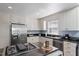 Well-equipped kitchen with stainless steel appliances, granite countertops, and white cabinetry at 352 Weymouth Close, Pittsboro, NC 27312