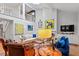 Inviting living space with soaring ceilings, abundant artwork, and natural light at 352 Weymouth Close, Pittsboro, NC 27312