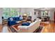Bright living area featuring hardwood floors, large windows, and stylish furniture at 352 Weymouth Close, Pittsboro, NC 27312