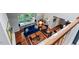 Bright living room features a fireplace, window seat, hardwood floors, and plush seating at 352 Weymouth Close, Pittsboro, NC 27312