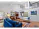 Open-concept living room with high ceilings and a view of the upper-level landing at 352 Weymouth Close, Pittsboro, NC 27312