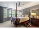 Comfortable main bedroom with a four-poster bed, bay windows, and plush carpeting at 352 Weymouth Close, Pittsboro, NC 27312