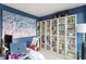 Bright office space features custom built-in bookshelves and a large abstract painting at 352 Weymouth Close, Pittsboro, NC 27312