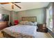 Spacious bedroom featuring a ceiling fan and natural light at 3712 Old Coach Rd, Raleigh, NC 27616