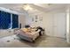 Bedroom with a ceiling fan, natural light, and neutral-colored walls at 3712 Old Coach Rd, Raleigh, NC 27616