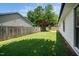 Spacious backyard featuring well-maintained lawn with wooden privacy fence at 401 Wyndham Drive, Fuquay Varina, NC 27526