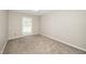 Empty bedroom with neutral walls and carpet at 401 Wyndham Drive, Fuquay Varina, NC 27526